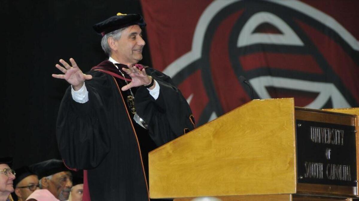 USC President Harris Pastides leads new graduates in a "GAME" and "COCK" cheer during commencement exercises on May 10, 2014, at the Colonial Life Arena. The Saturday afternoon commencement exercises included students graduating from the College of Education; Interdisciplinary Programs; College of Engineering and Computing; College of Social Work: College of Hospitality, Retail and Sports Management; the School of Music and Palmetto College.