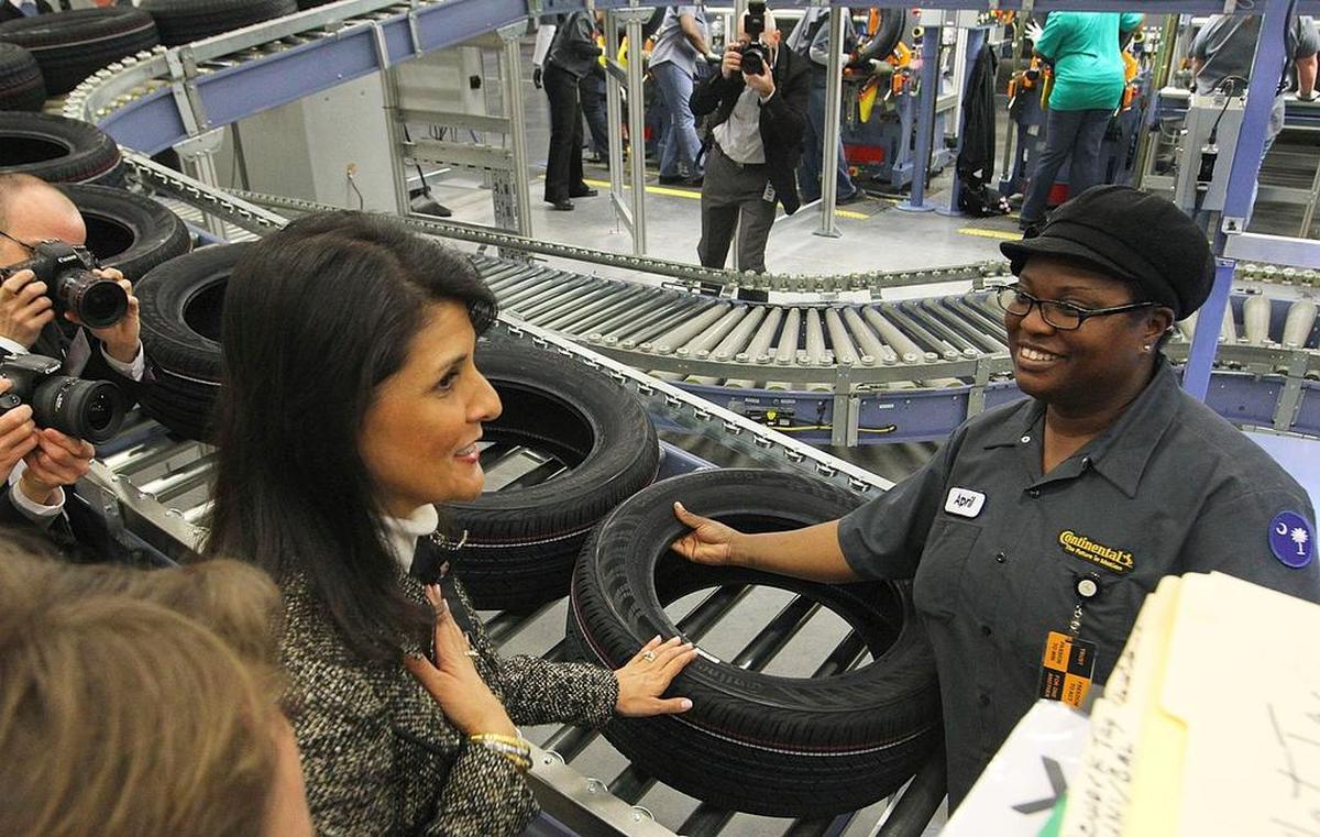 Then-Gov. Nikki Haley talks briefly with visual inspector Carolyn McClendon at Continental Tire’s Sumter plant in 2014.
