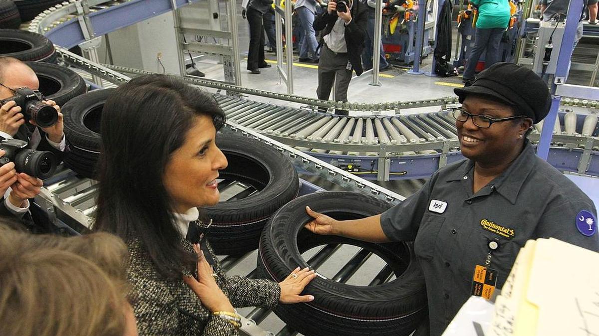 Then-Gov. Nikki Haley talks briefly with visual inspector Carolyn McClendon at Continental Tire’s Sumter plant in 2014.
