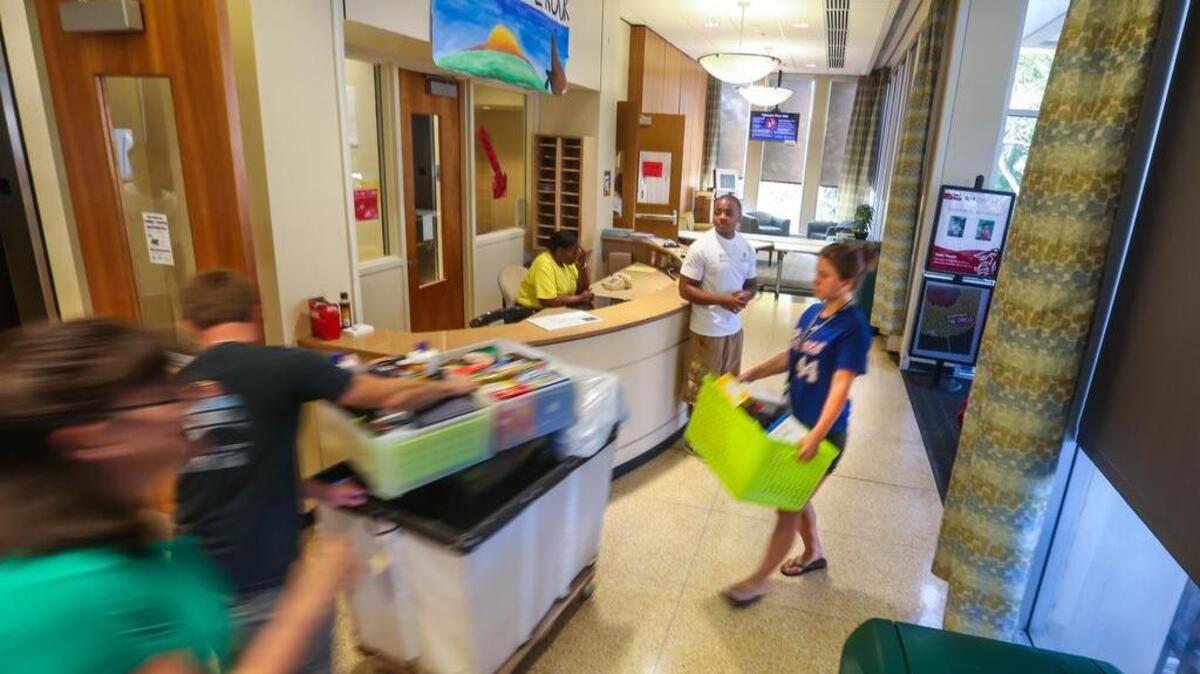 FILE: USC freshmen began to move into their dorms on campus Friday. Families worked on a staggered schedule making for a more organized experience. Here, the traffic in the South Towers was steady. 8/15/14