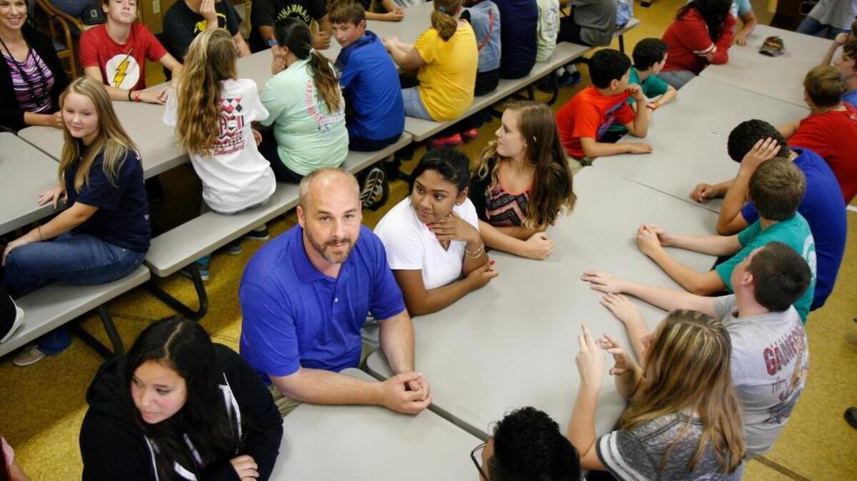 
The Rev. Kevin Crosby, pastor of Red Dam Baptist Church of Hardeeville, sits among the nearly 100 students of Legacy Christian Academy in the cafeteria of Euhaw Baptist Church in Ridgeland. Crosby hopes to get the congregation self-sustaining and to bring the historic church back into use.
