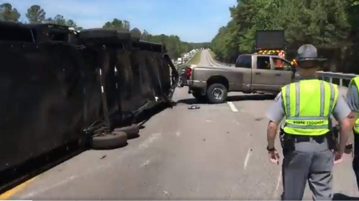 An overturned camper is blocking all westbound lanes on I-26 in Lexington County.