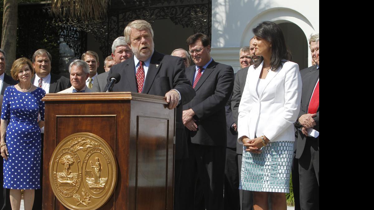 
Commerce Secretary Bobby Hitt is joined by Gov. Nikki Haley and state officials outside the Governor's Mansion Complex as they make it official by announcing Volvo will build a $500 million factory in Berkeley County to produce 100,000 cars a year.
