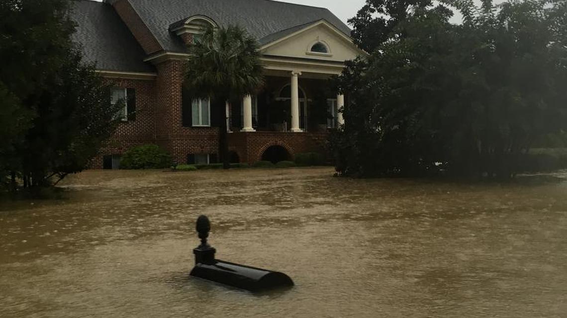 
Rising floodwaters swamped King’s Grant neighborhood Oct. 4. Some neighbors blame failing dams for the flood. 
