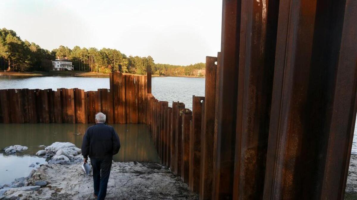 Mindful of potential danger to communities downstream, workers and WildeWood residents preserved the dam with resources including pumping, trenches, rocks, 1-ton sandbags and a retaining wall.