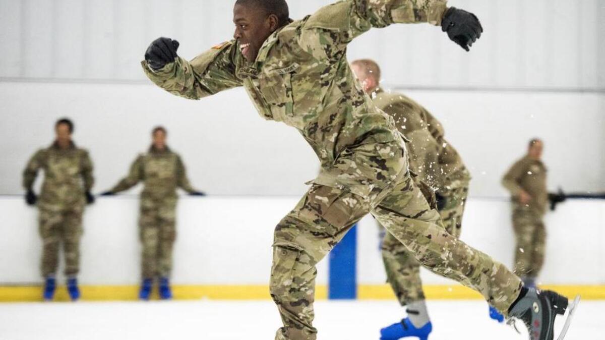 Soldiers race on ice-skates at The Plex on Wednesday in Irmo. For soldiers who choose to remain on base at Fort Jackson during the holidays, a variety of activities are organized to help them enjoy their break.