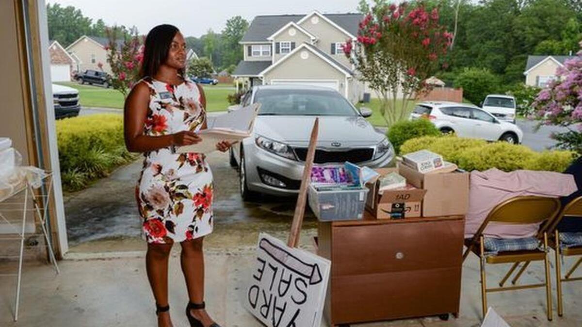 Dabrica Webster of Anderson, one of few black women real estate agents in the Upstate, visits a home that she is helping to sell near T.L. Hanna High School in Anderson.