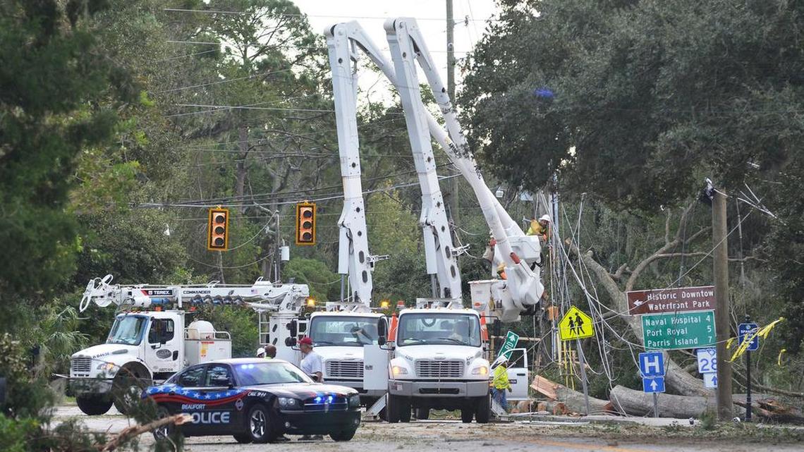 Electrical crews remove damaged power lines and poles after Hurricane Matthew hit the Lowcountry.