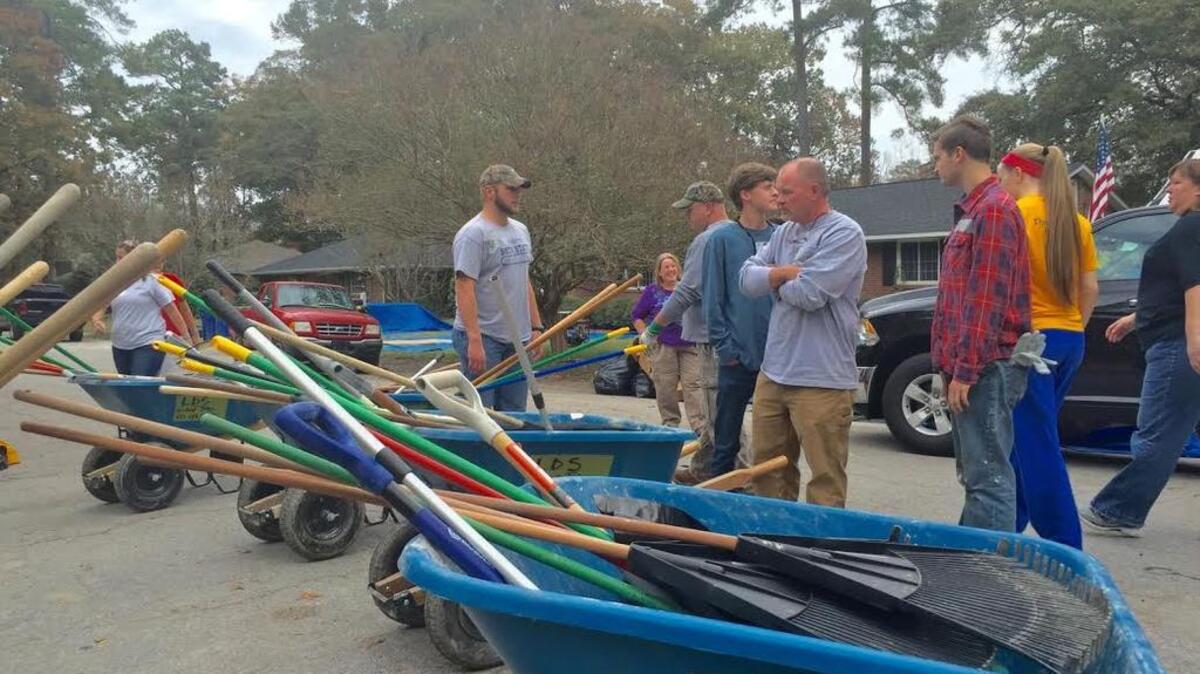 Volunteers continue to pour into the neighborhood along Glenhaven and Timberlane drives off South Beltline Boulevard in the aftermath of floods in early October.