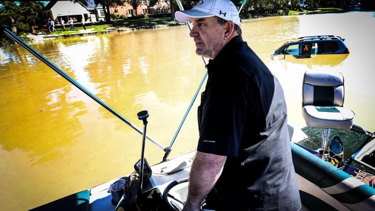 
Elliott Powell rescued dozens of Lake Katherine residents with his deck boat and a canoe during Sunday’s rising flood waters. 
