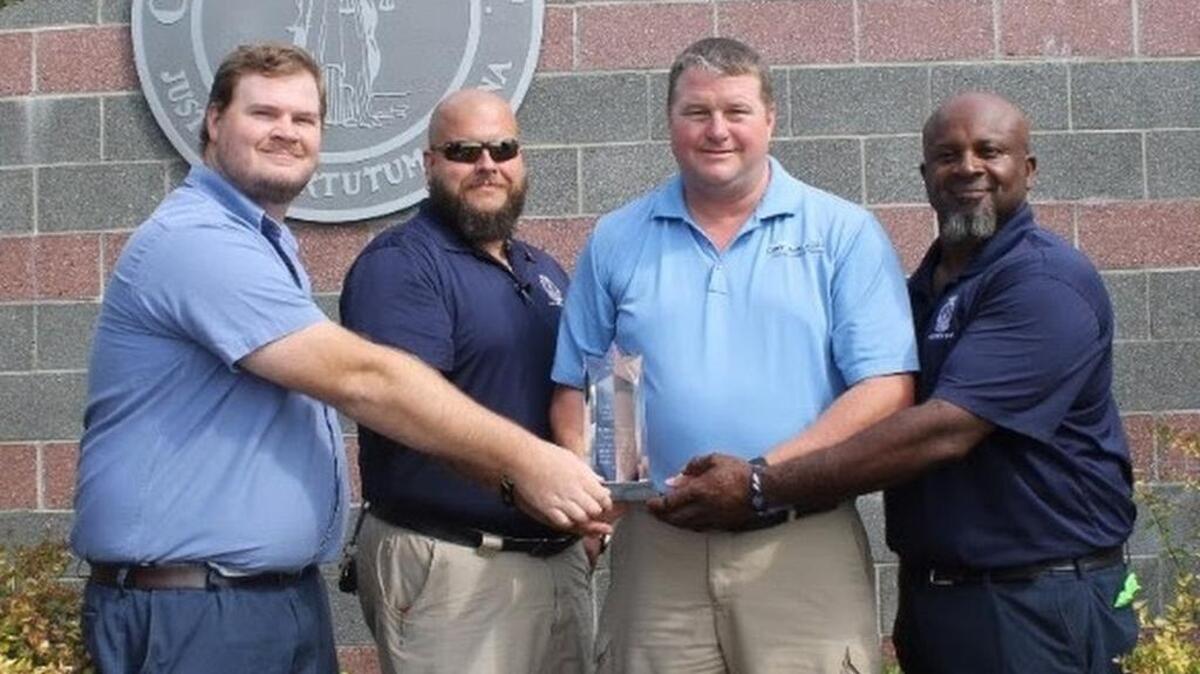 Brandon Wilcox, Adrian Martin, Ashley Dove and James Foust have been nationally recognized for their actions that prevented a disastrous sewage overflow during the October 2015 flood.