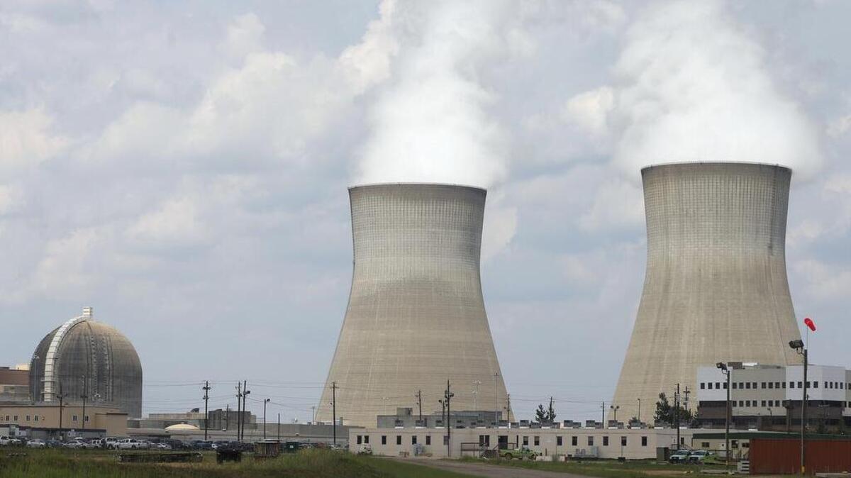This June 2014 file photo, shows the cooling towers, right, and nuclear reactor containment buildings area, left, at Plant Vogtle Nuclear Power Plant in Waynesboro, Ga. Westinghouse is laying off 113 at its nuclear facility under construction in Rock Hill.