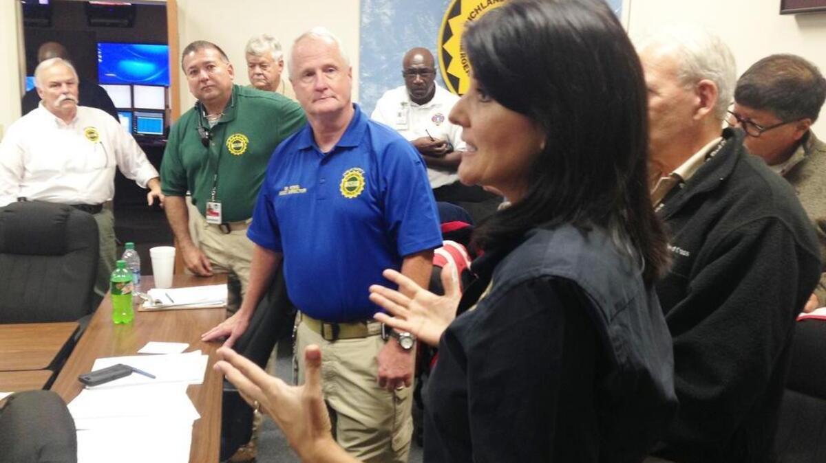Michael King (in blue shirt) and others listen to Gov. Nikki Haley who visited Richland County’s Emergency Operations Center during the height of the flood response. King has been hired as the county’s new flood recovery chief.