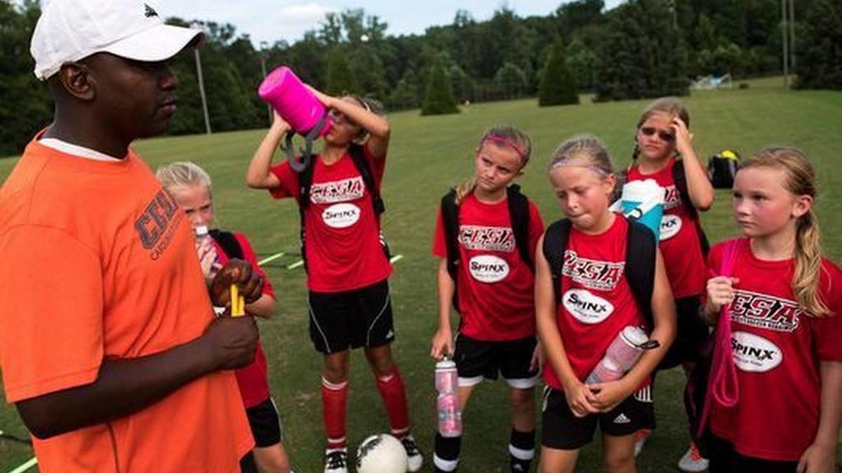 CESA coach Terrance Shearn speaks with girls on his U10 and U11 teams after a recent practice at the Wenwood Soccer Complex.