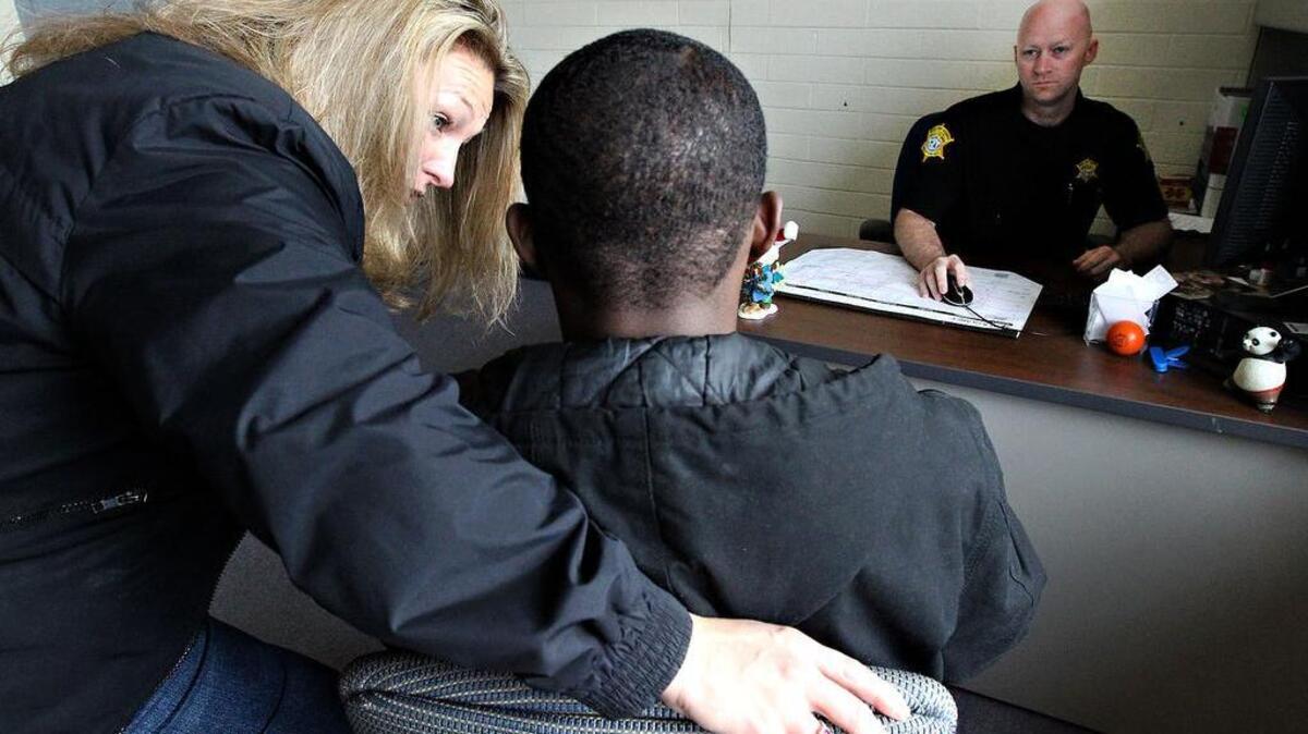 Deputies talk with a student in 2011.