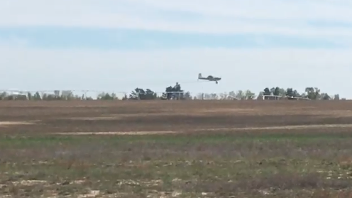 Crop dusting plane flies over mega farm in Aiken County