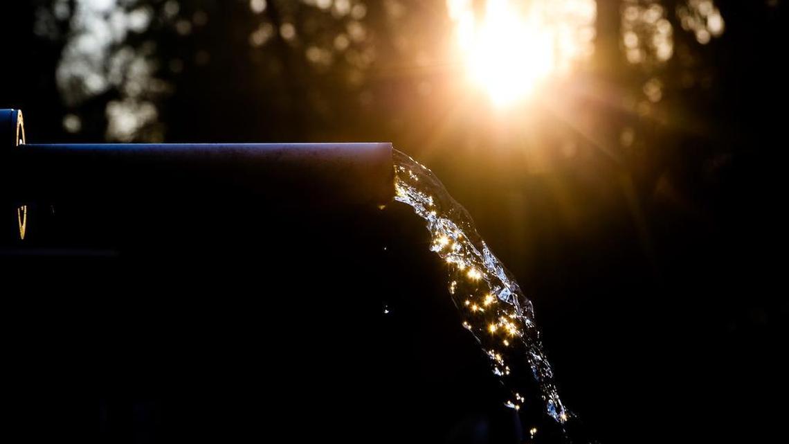 Water falls from an artesian well in rural, Aiken county.