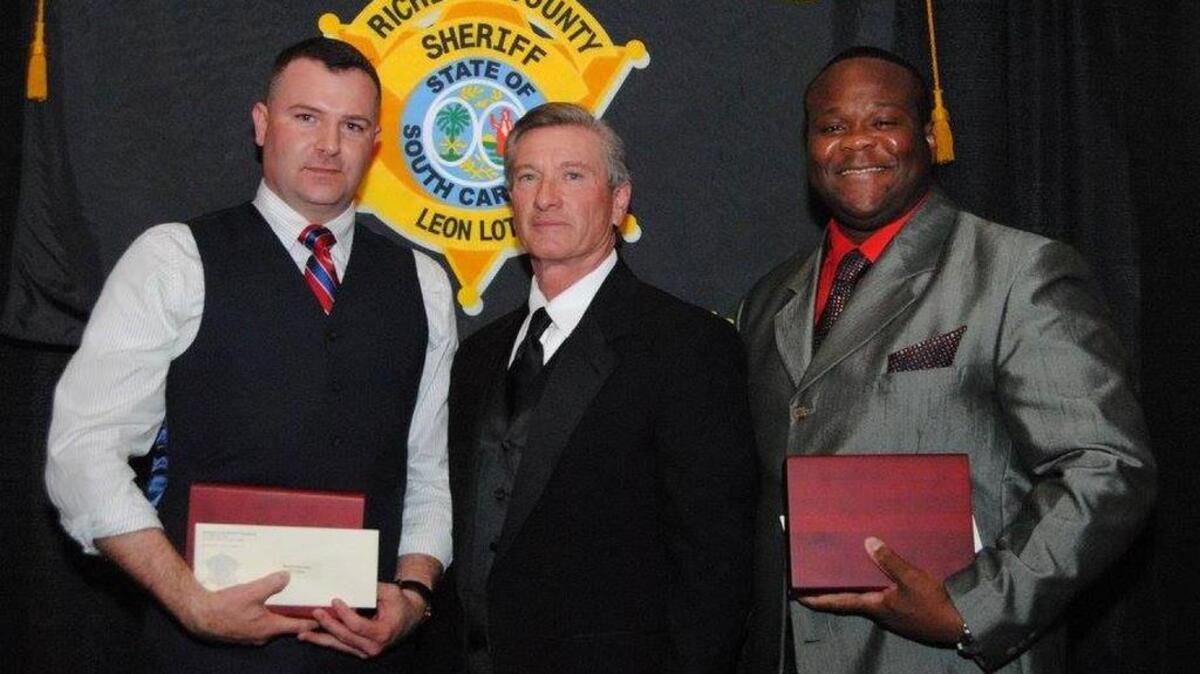 (From left) Duke, Lott and Trobathian