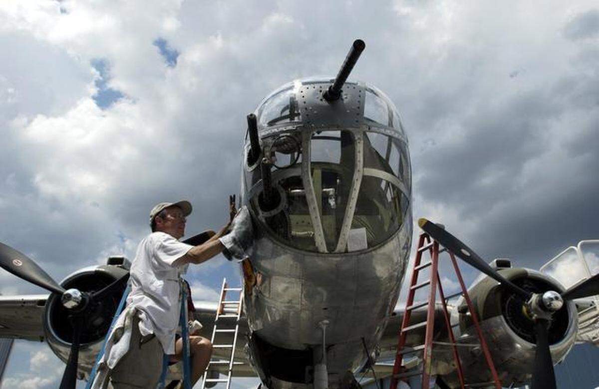 Larry Kelley cleans Ponchito, a B-25 similar to the ones flown during the Doolittle Raid. Ponchito and over a dozen B-25’s will be on display at Owens Field as part of the Doolittle Raiders reunion. 4/15/02