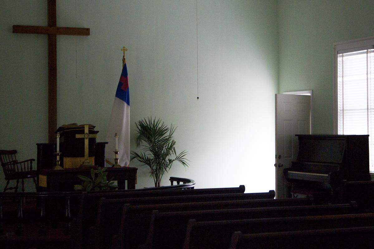 Church pews, a piano, and the altar still remain inside Cedar Creek United Methodist Church in Blythewood, SC.The church was closed in 2017 after attendance fell to four people.