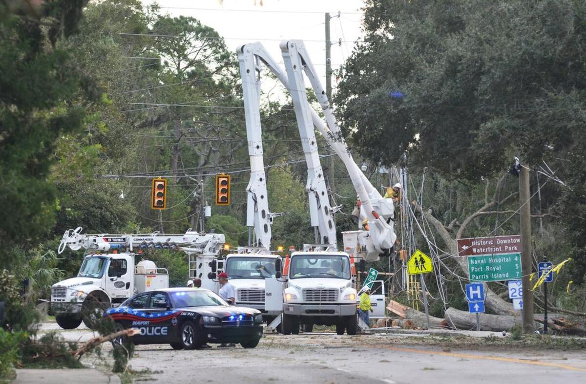 Electrical crews remove damaged power lines and poles and replace them on Ribaut Road on Oct. 8, 2016, fewer than 24 hours after Hurricane Matthew did significant damage to the electrical infrasctructure along Ribaut Road and the rest of Beaufort County. By late afternoon, multiple crews were busy repairing what Matthew had destroyed.