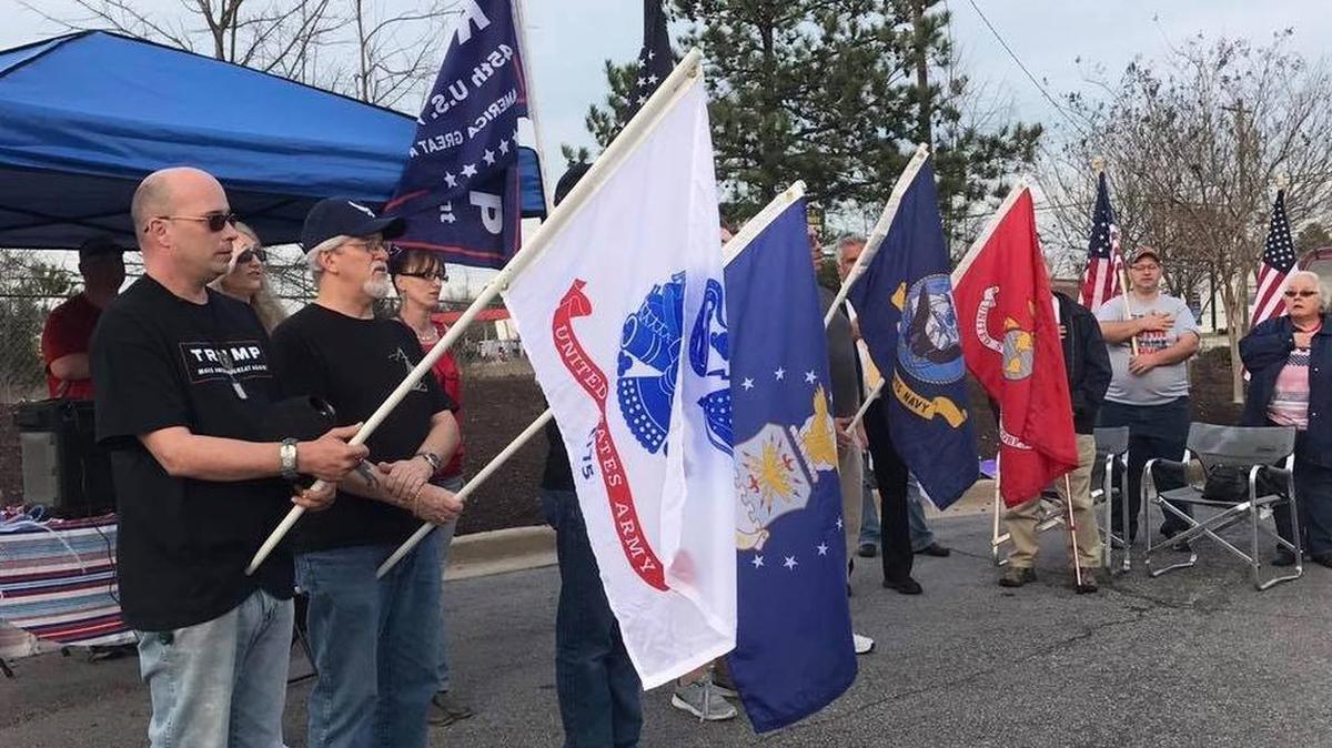 People participate in a pro-Trump rally in Lexington on Monday.