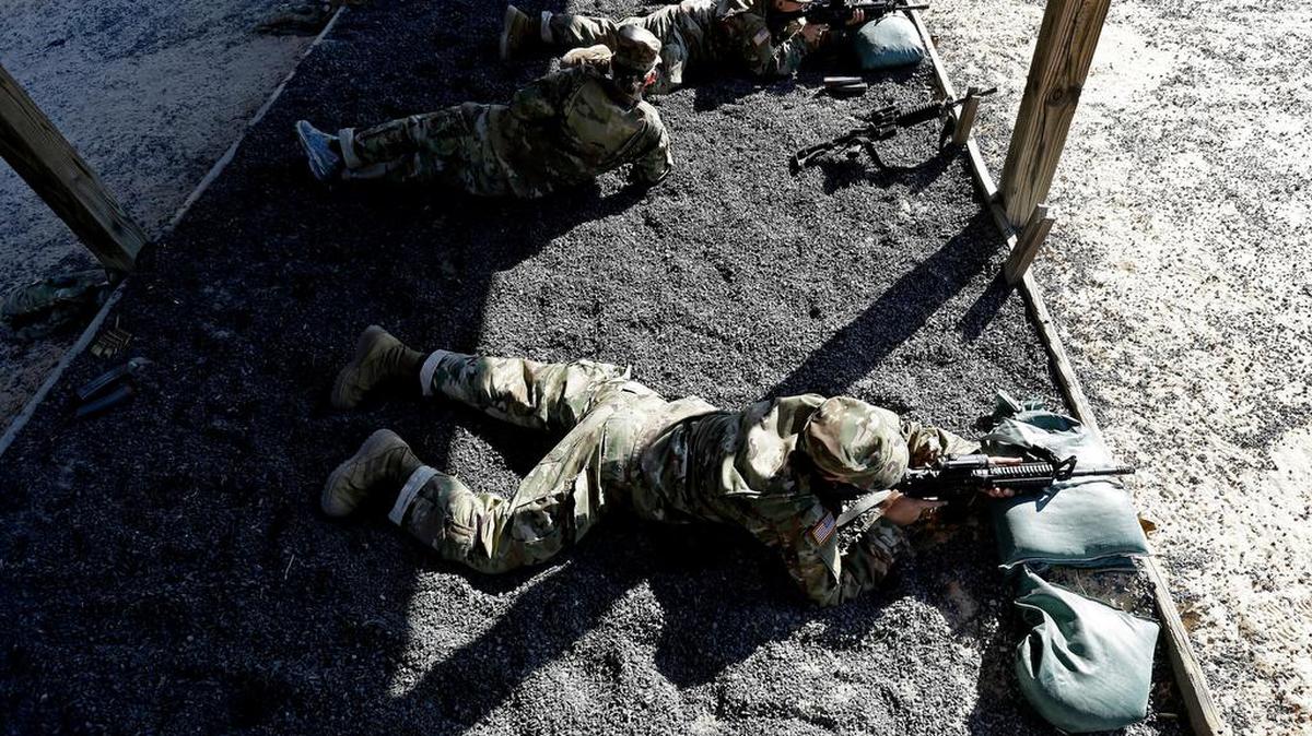 A U.S. Army recruit lies prone during marksmanship live-fire training at Fort Jackson.