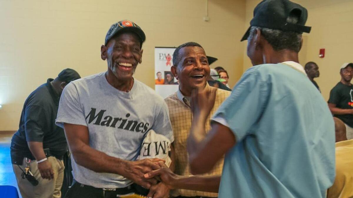 FILE PHOTO: Charles Love, left, is a Marine veteran serving from 1972-1977. He attended an event at the Dorn VA Center in 2014 to talk with agencies in hopes of finding housing and job opportunities.
