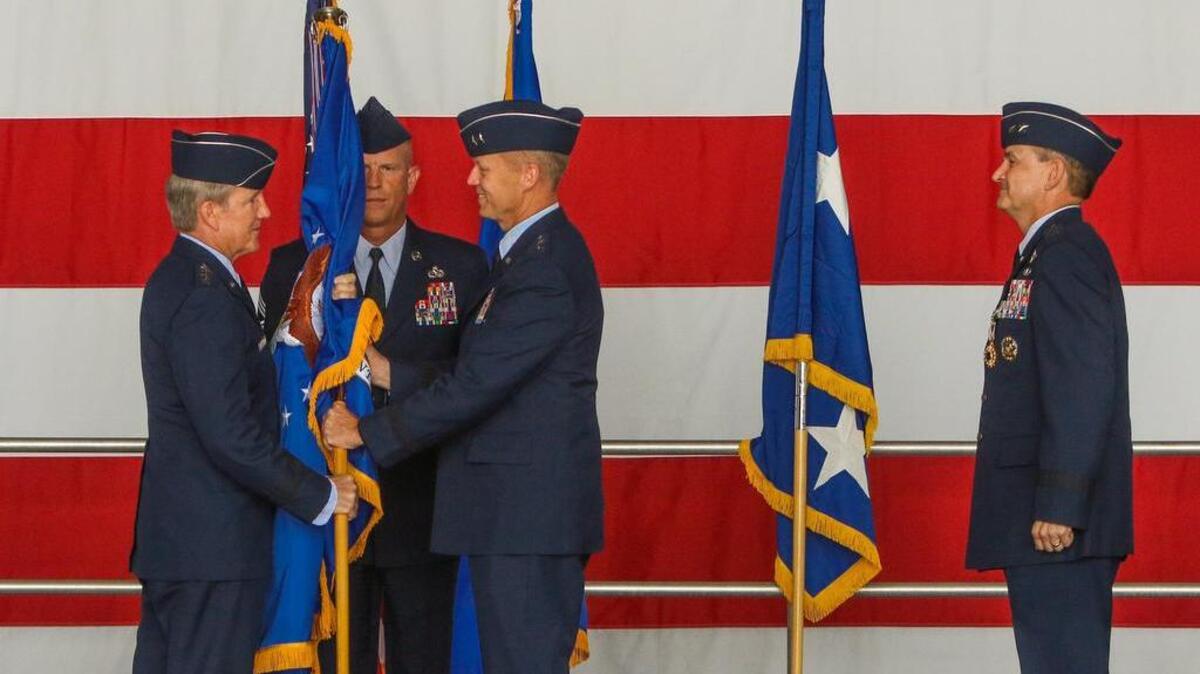 
With the passing of the guidon, Maj. Gen. Mark D. Kelly took command of Ninth Air Force Headquarters from Maj. Gen. H. D. Polumbo, far right, during a ceremony at Shaw Air Force Base Friday. Gen. Herbert J. "Hawk" Carlisle, left, commander of Air Combat Command officiated the ceremony. Part of the ceremony is removing the name of the previous commander and replacing it with the new one, pictured below.
