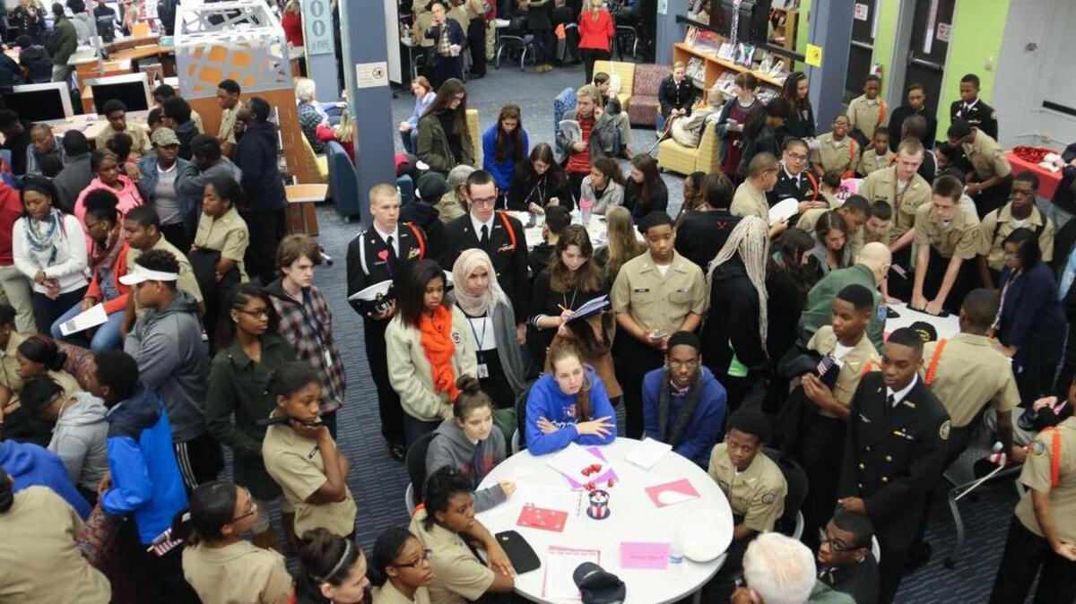 Some 200 Richland Northeast High School students packed the Media Center Friday to hear firsthand tales of the toll war takes on veterans.