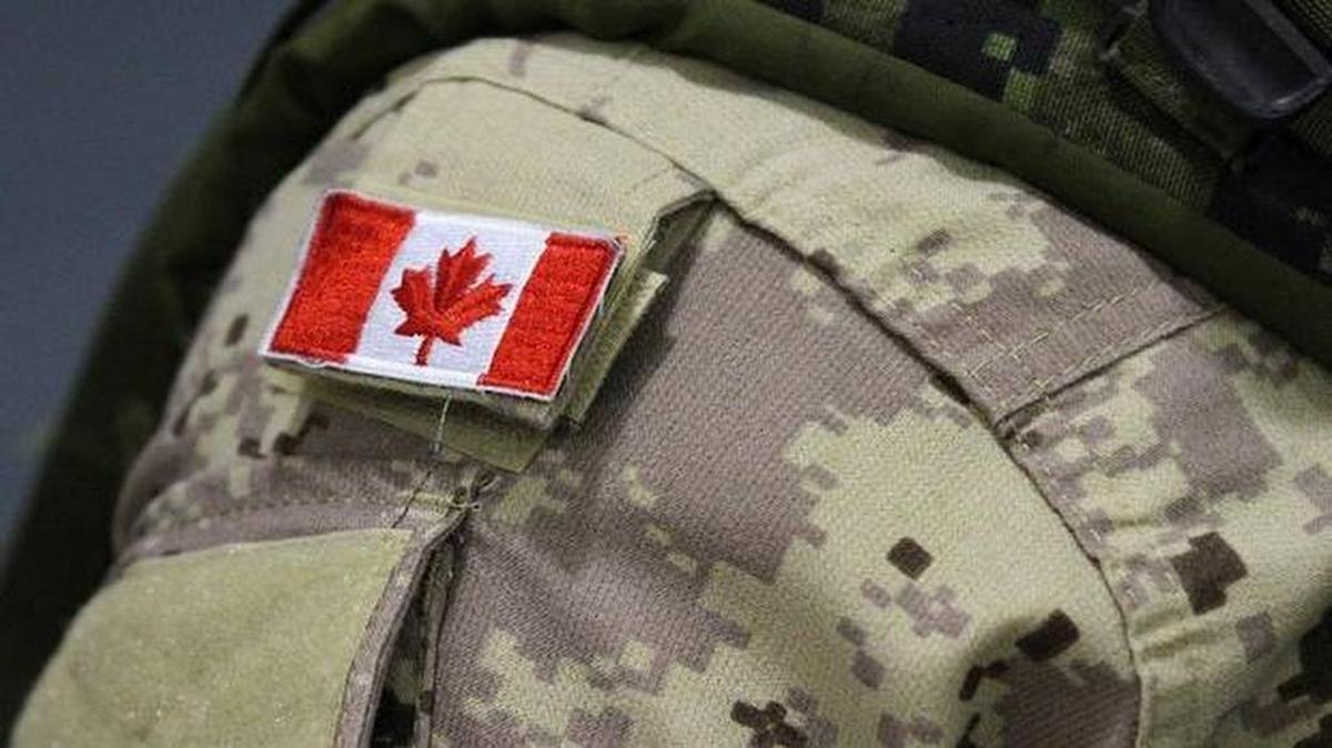 A Canadian flag sits on the shoulder of a member of the Canadian Forces in Trenton, Ont.