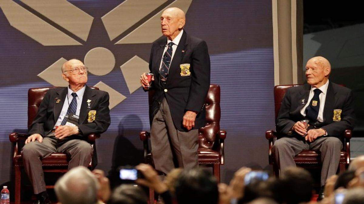 
 In this Nov. 9, 2013 Richard Cole, center, proposes a toast with two other surviving members of the 1942 Tokyo raid led by Lt. Col. Jimmy Doolittle, Edward Saylor, left, and David Thatcher, at the National Museum for the US Air Force in Dayton, Ohio. The group will receive the Congressional Gold Medal on April 15, 2015, in Washington, then hand it over April 18 to the museum for display its exhibit depicting the launch from an aircraft carrier of the Raiders daring 1942 bombing attack on mainland Japan. 
