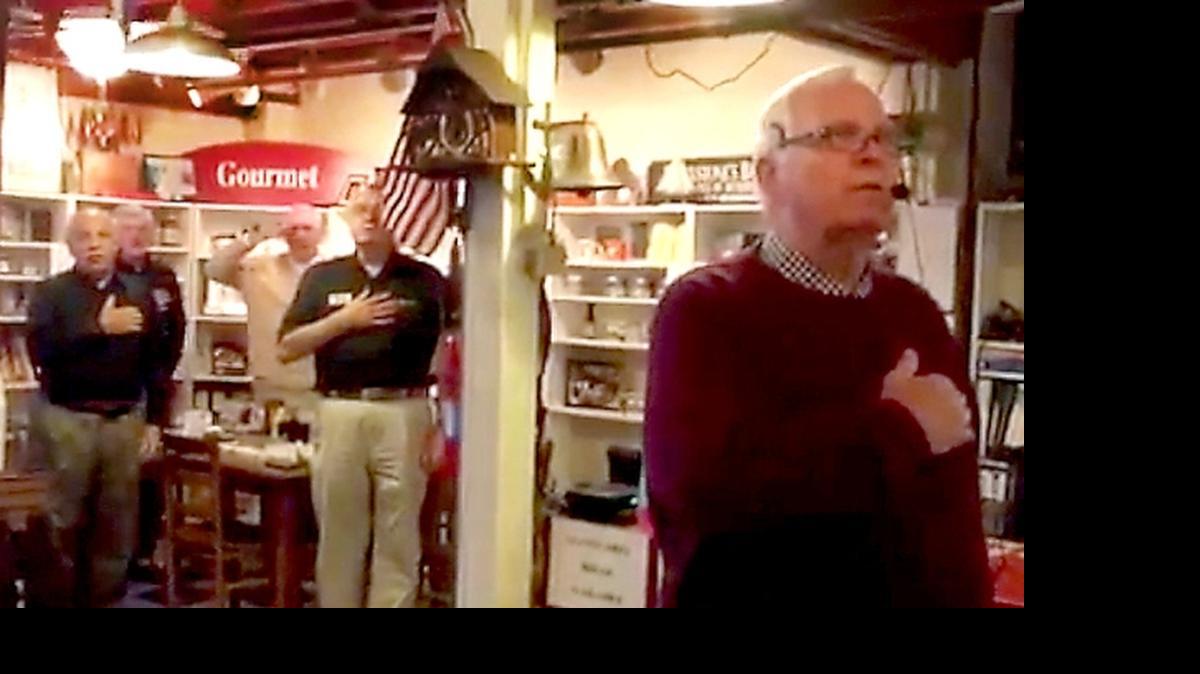 
Blackstone’s Cafe owner Roger Alley, front, leads patrons of his restaurant during a recent reciting of the Pledge of Allegiance. 
