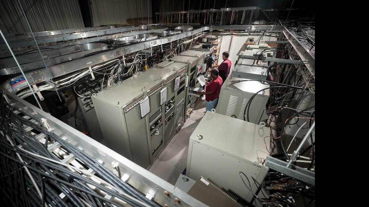 
 SPAWAR Atlantic workers monitor a communication system for an aircraft carrier at a Test and Integration Facility at the center near Charleston
