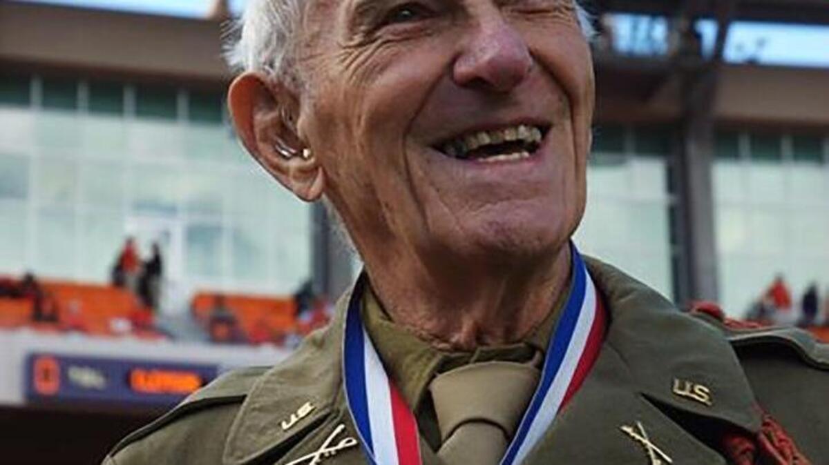 
Mickey Dorsey of Chester smiles as he shows some of the medals he earned during his World War II service. 

