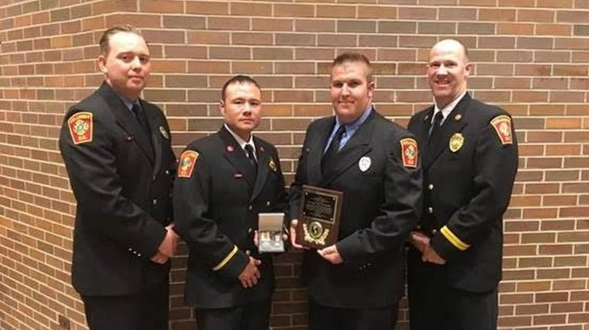 Accepting the award for rescue work in last fall’s flood were (from left) Columbia senior firefighter Thomas Ellisor, Capt. Kurt Pashoal, senior firefighter Greg Heinisch and special operations chief Jason Krusen.