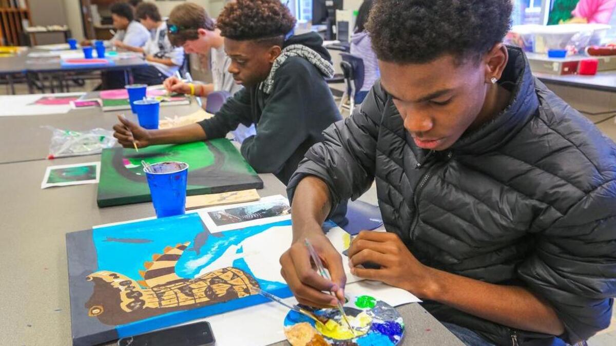 Dreher High School students Siah Newton, second from right, and Tyree White are studying works and writings by Georgia O’Keeffe and trying to create art that echoes her style. O’Keeffe taught for a time at Columbia College.