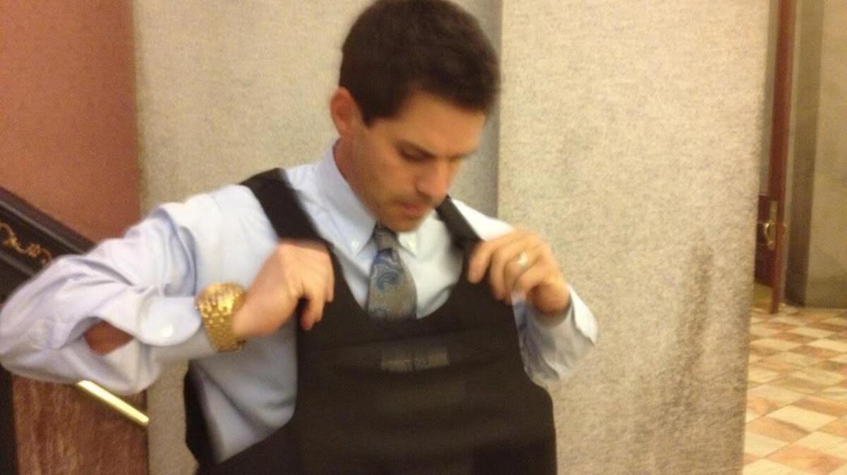 
Pelion Police Detective Sgt. T.R. Scofield tries on one of the new protective vests donated Thursday to the Lexington County town’s Police Department.
