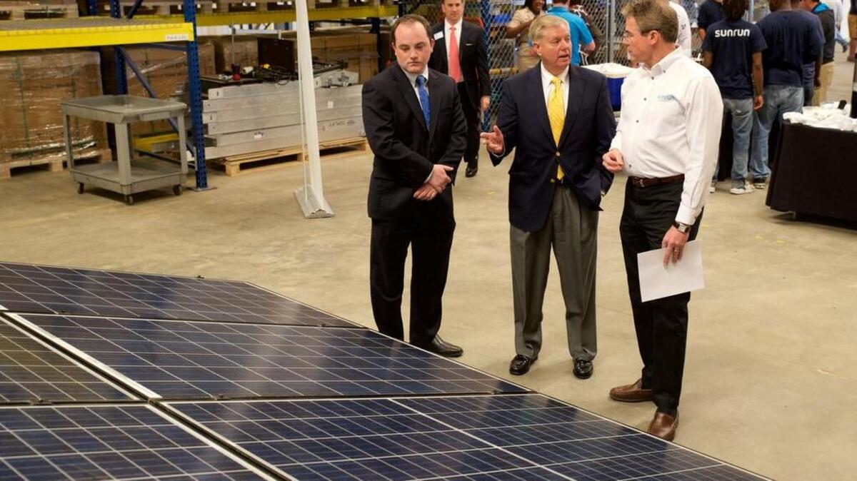 U.S. Sen. Lindsey Graham, R-S.C., surveys solar panels at opening of new Sunrun office Monday in Columbia