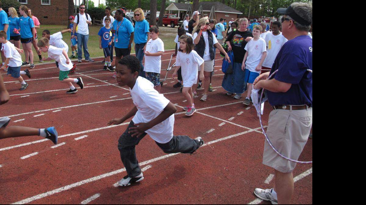 
Competitors take off from the starting blocks for the 100-meter run during Friday’s Kershaw County Special Olympics.
