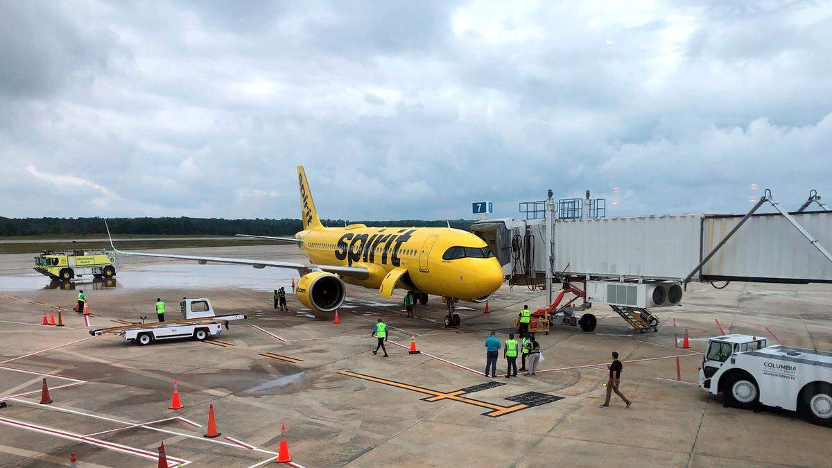 A Spirit Airlines plane sits at a gate at the Columbia Metropolitan Airport, waiting to make the carrier’s inaugural flight to Newark, New Jersey on June 5, 2025.