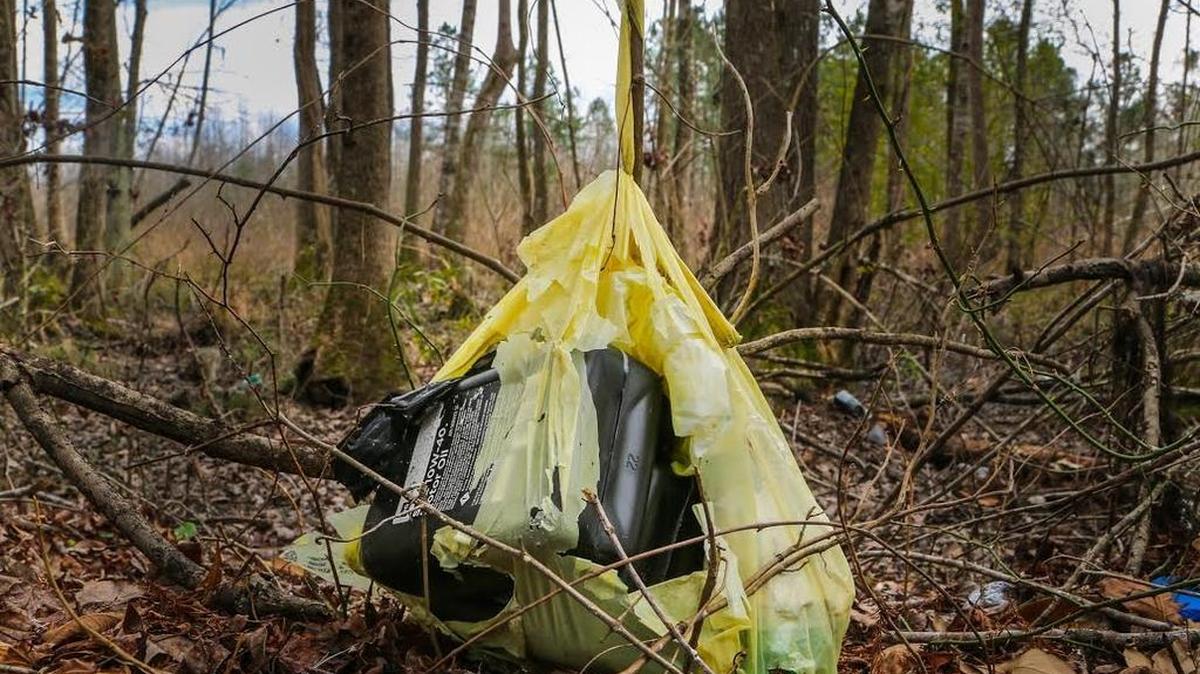 Plastic bags and oil bottles litter the banks of the Edisto River’s South Fork last month. Plastic bags are handy for carrying groceries but major sources of litter in South Carolina.
