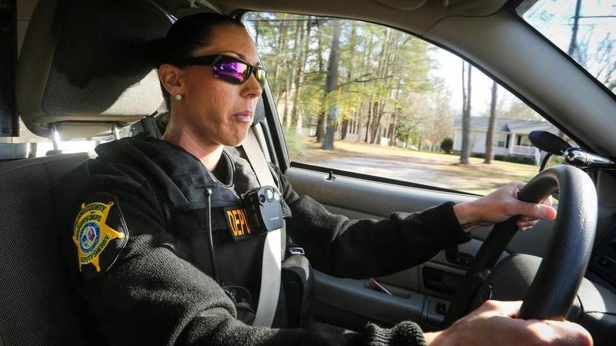 Aubree Taylor demonstrates one of the body cams the Richland County Sheriff’s Department has tested for deputies.