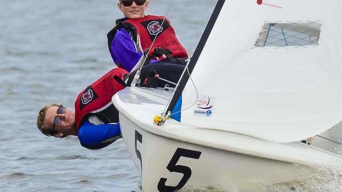 University of South Carolina students Kate O’Donnell, top, and Logan Galbreath sail recently on Lake Murray.