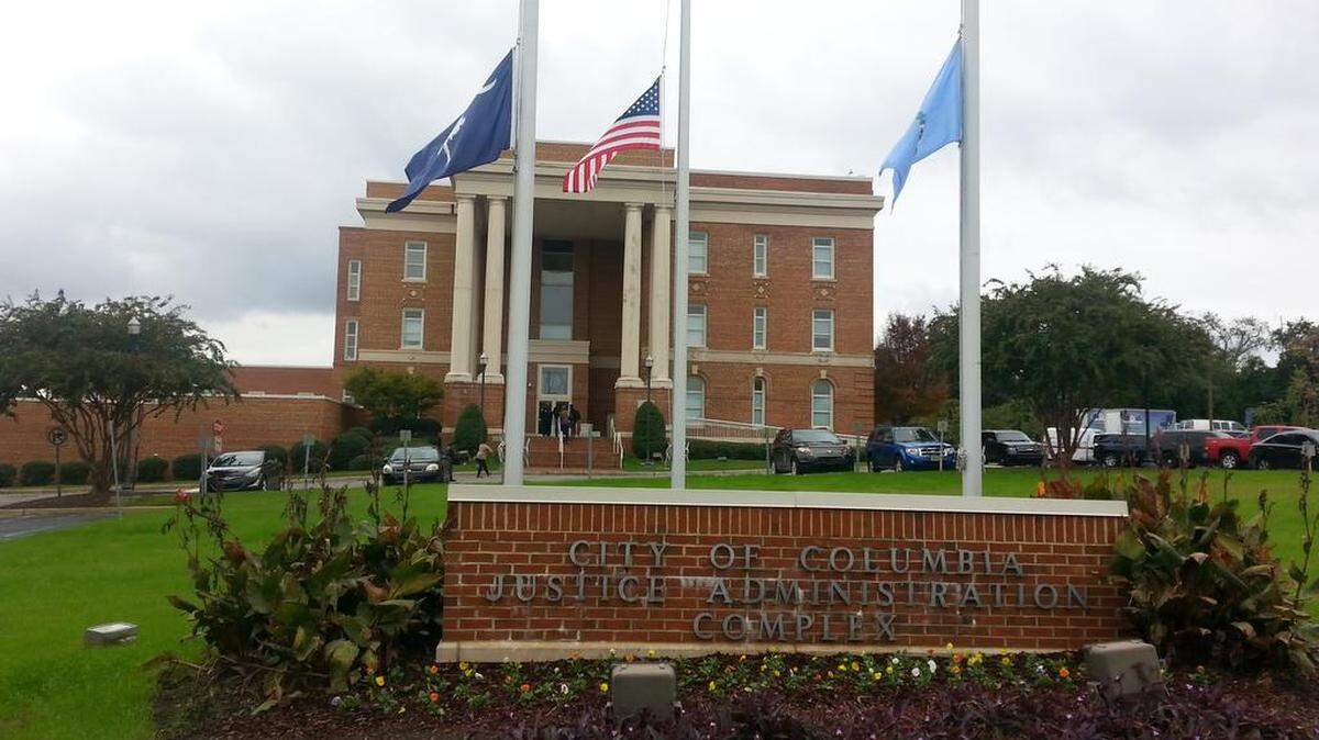 Flags at the Columbia Police Department flew half-mast Sunday in honor of officer Stacy L. Case, killed in a car crash Saturday night.