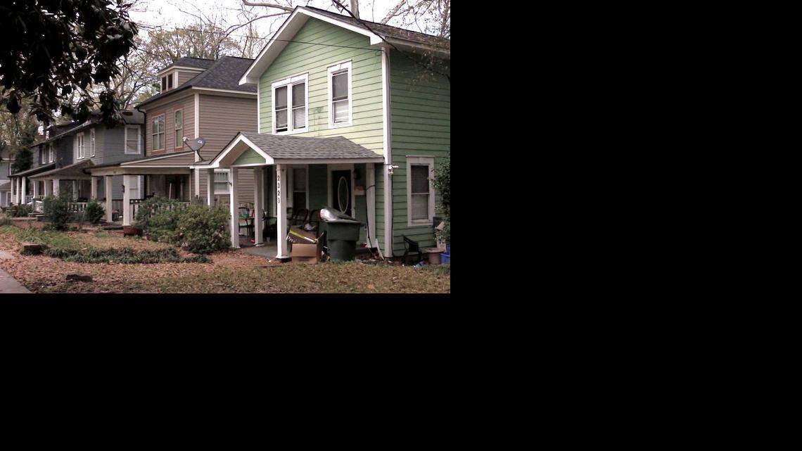 
Trash piles up on the front porch of a house on Lee Street where students tend to live. 
