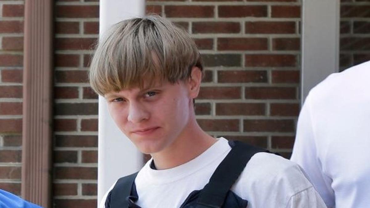
Charleston, S.C., shooting suspect Dylann Storm Roof is escorted from the Sheby Police Department in Shelby, N.C., Thursday, June 18, 2015. Roof is a suspect in the shooting of several people Wednesday night at the historic The Emanuel African Methodist Episcopal Church in Charleston, S.C.
