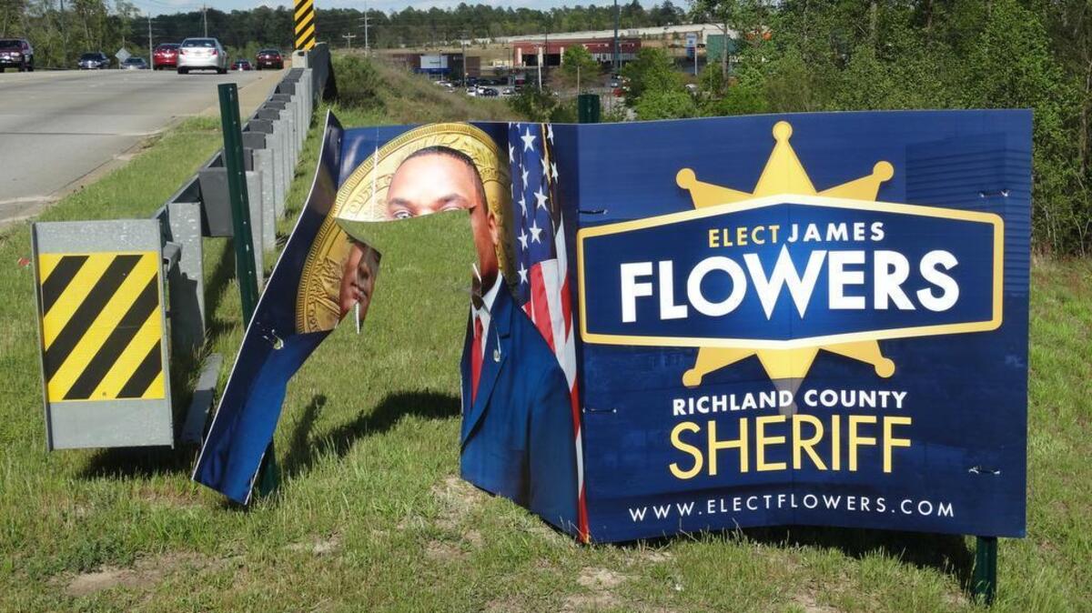 The candidate shared this photo with the news release about damaged signs.