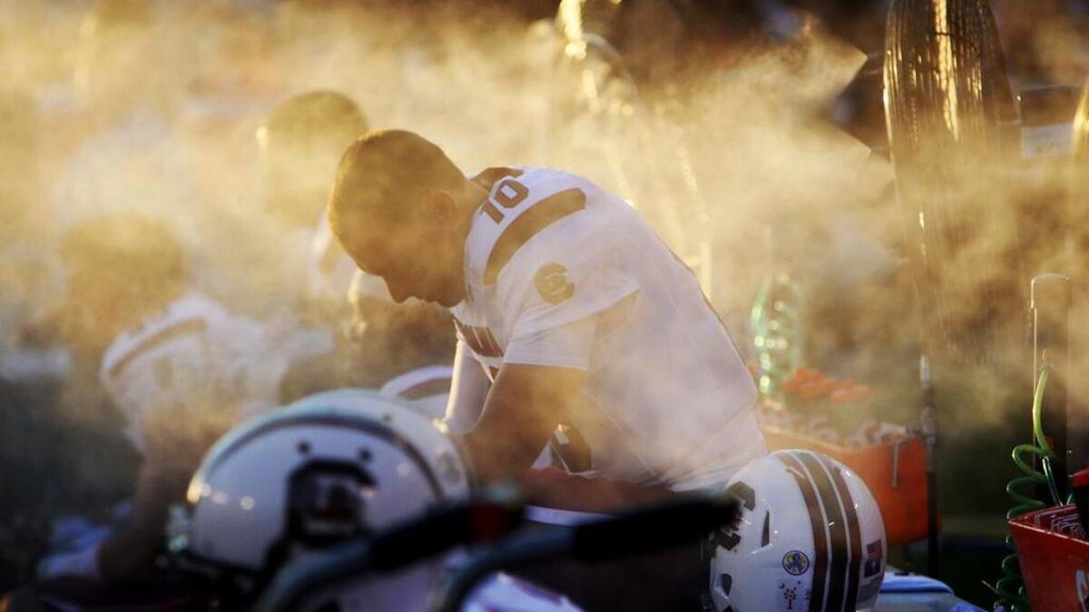 An award winning photo. South Carolina Gamecocks quarterback Perry Orth takes a breather on the bench during the first half at Sanford Stadium in Athens, Ga., on Sept. 19, 2015.
