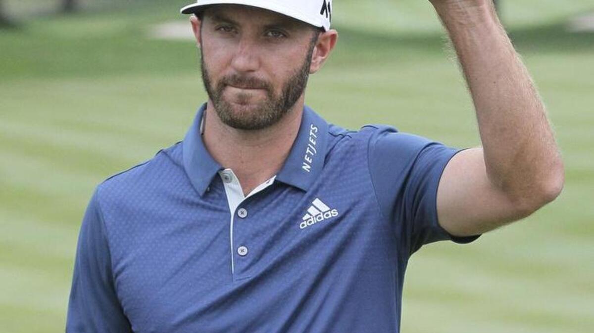 Dustin Johnson acknowledges applause after winning the WGC-Bridgestone Invitational on July 3. Johnson announced Friday he is withdrawing from the Olympics.